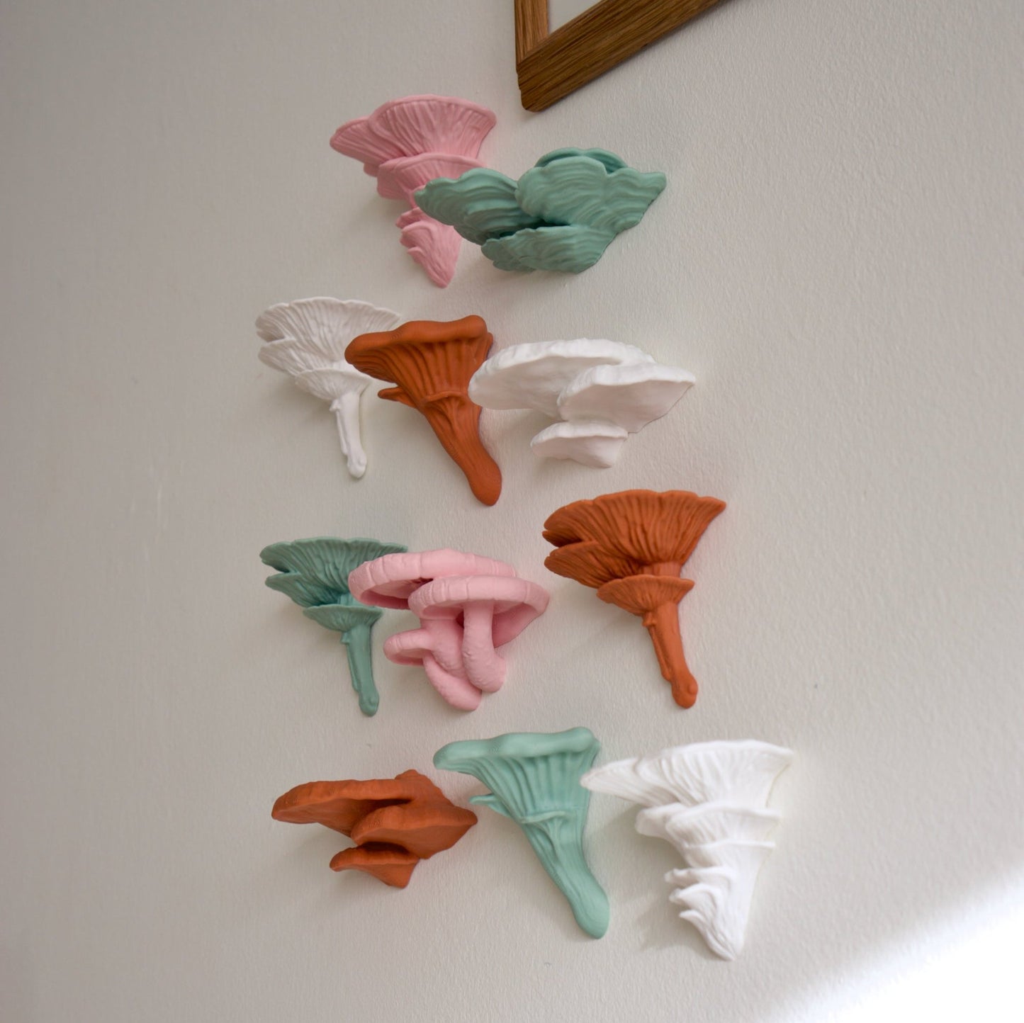 Mini stick on mushroom decor in pink, orange, green, and white.