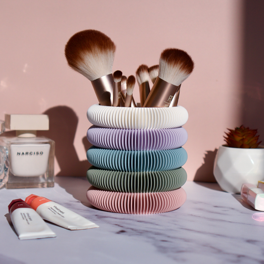 Multi-colour 3D printed makeup brush holder styled on vanity with brushes, perfume and skincare – handmade storage pot by Moonkind Studios