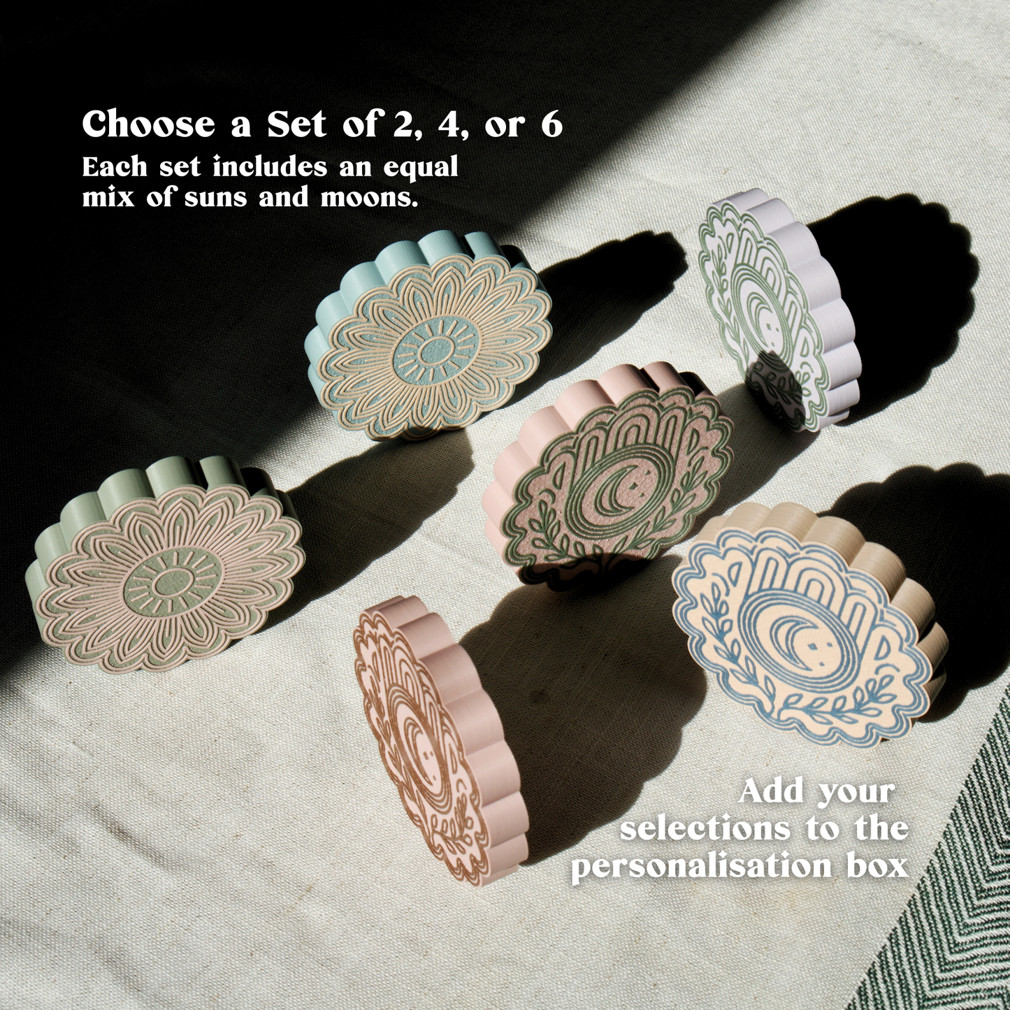 Set of sun and moon drink coasters in poetic pastel tones under natural light