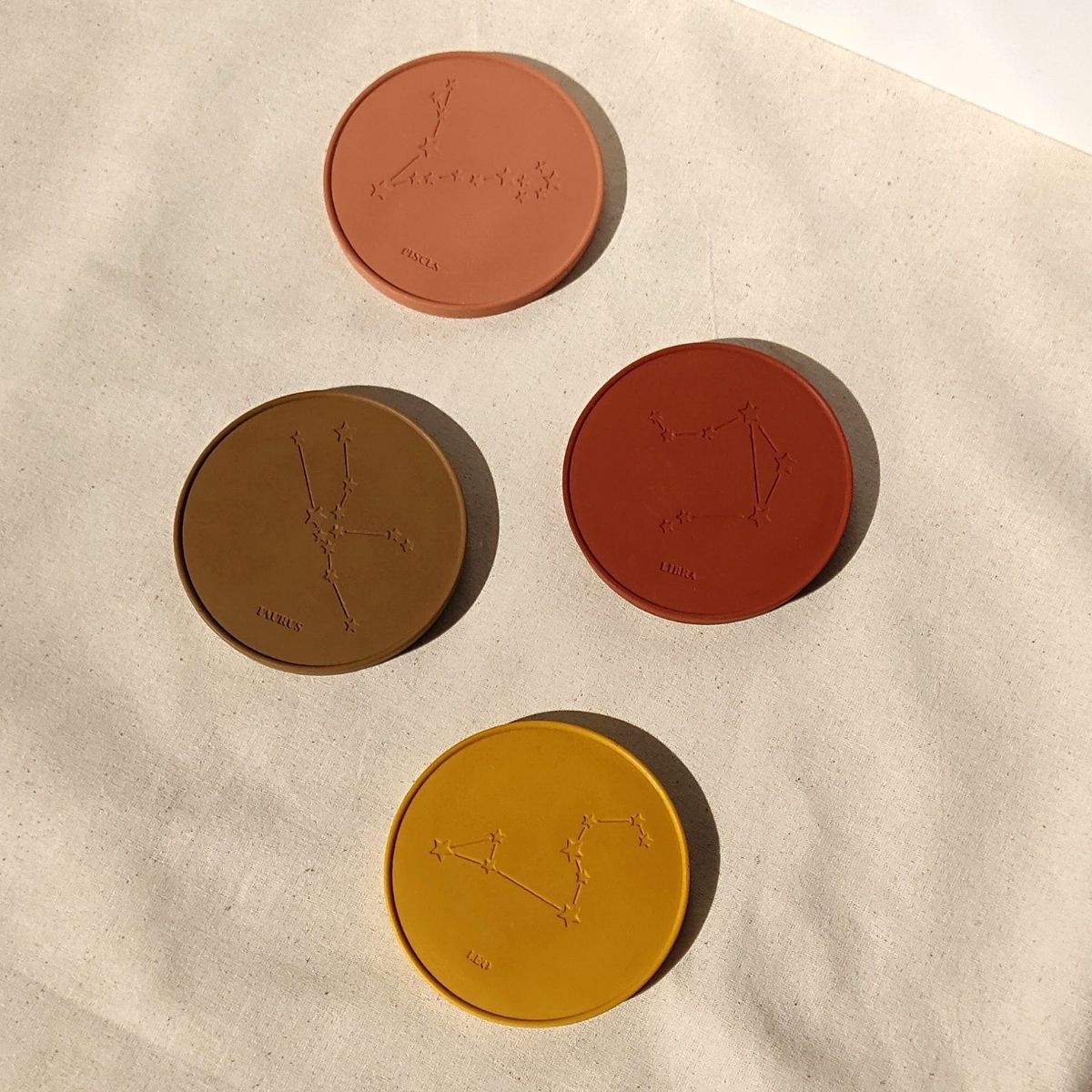 set of 4 custom coasters with star signs handmade by Moonkind Studios UK