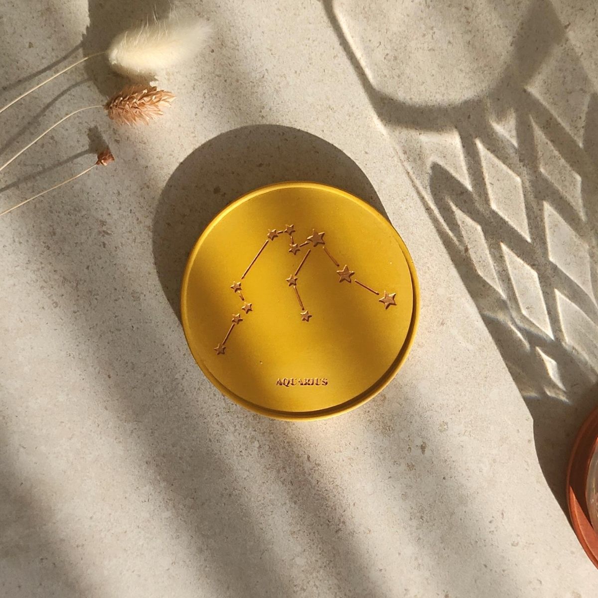 gold painted star sign coasters in turmeric colour Moonkind Studios UK