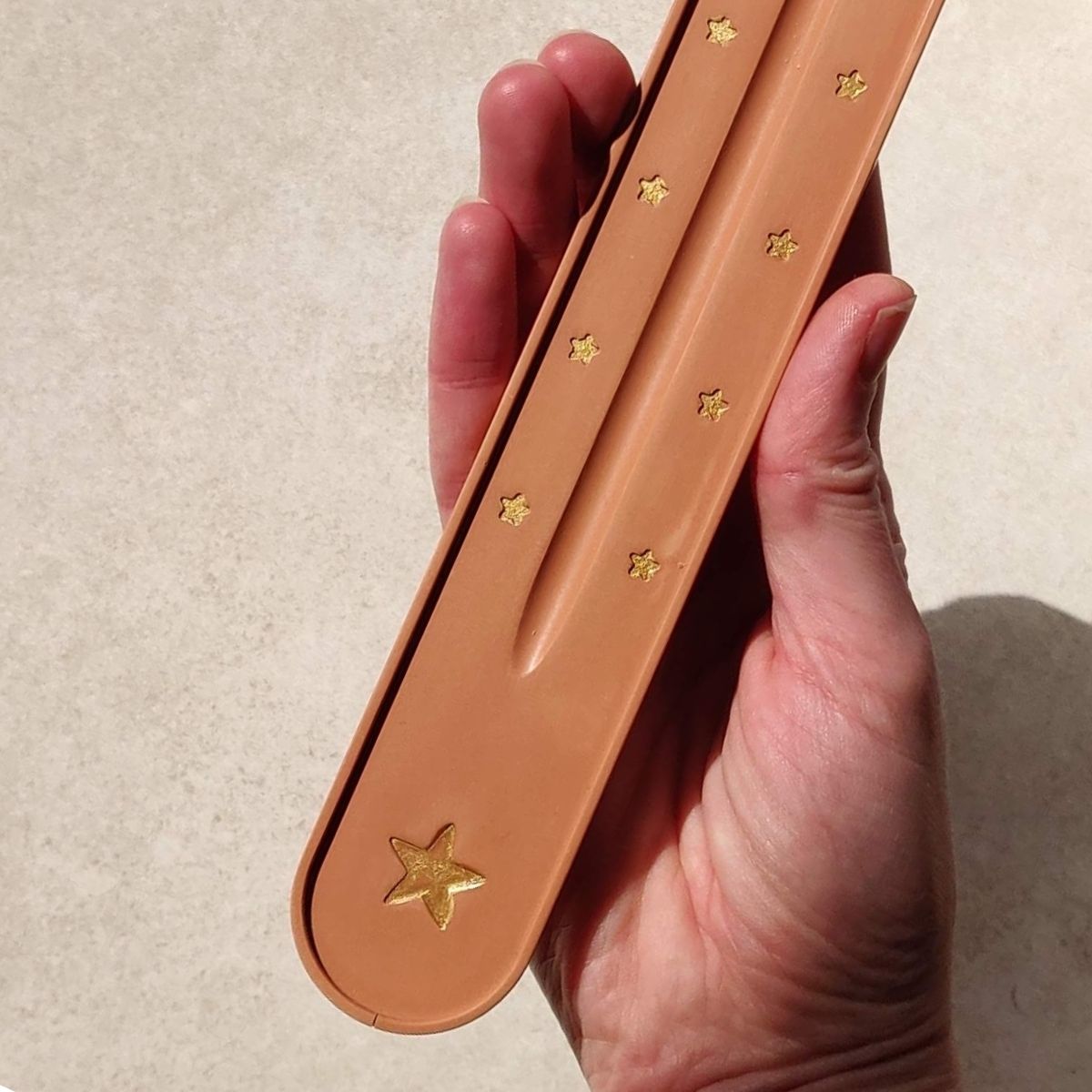 Holder for incense sticks. Handmade in the UK by Moonkind Studios. Handprinted in gold. Inspired by boho style home decor.