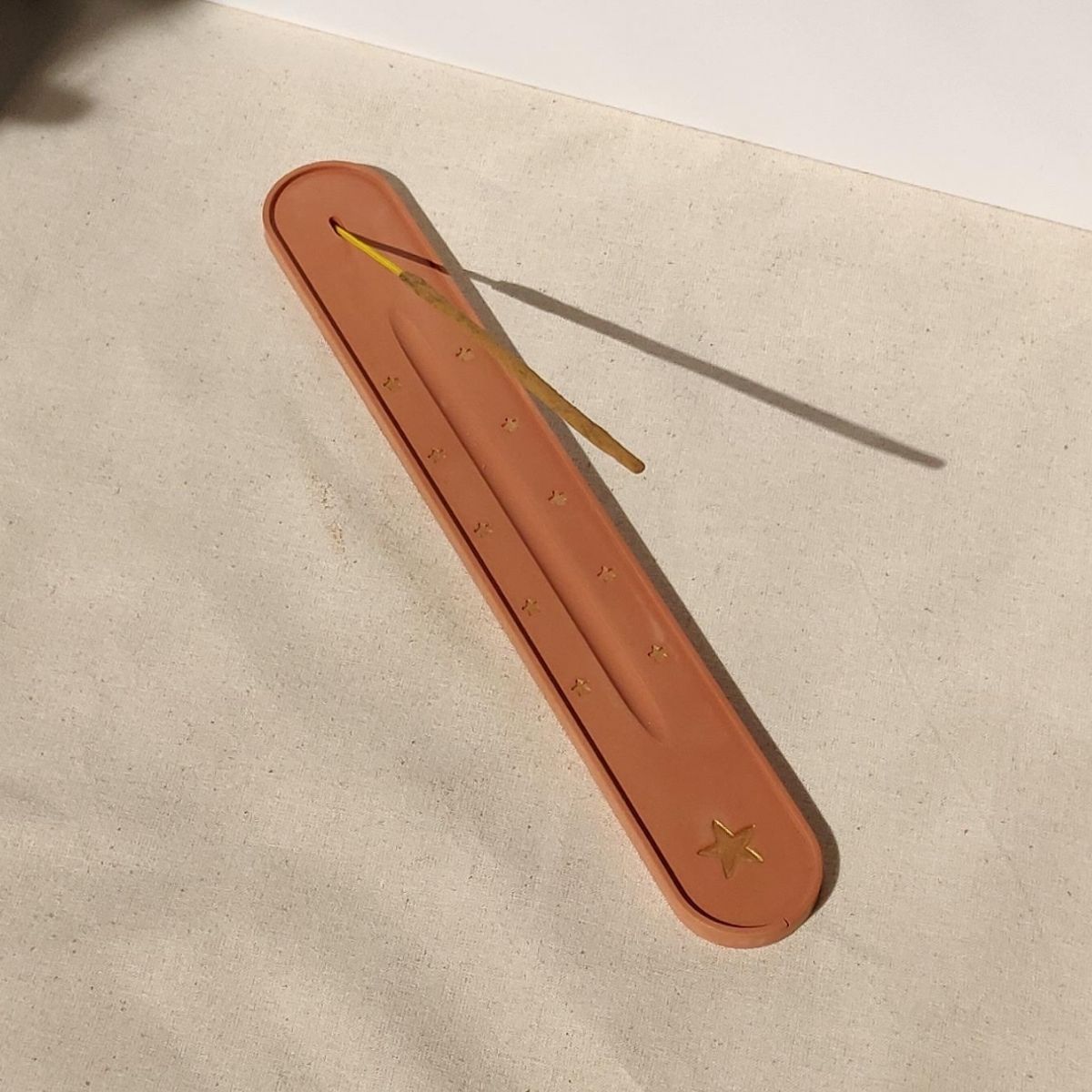 incense stick holder in pink handprinted with gold. Handmade by Moonkind Studios in England