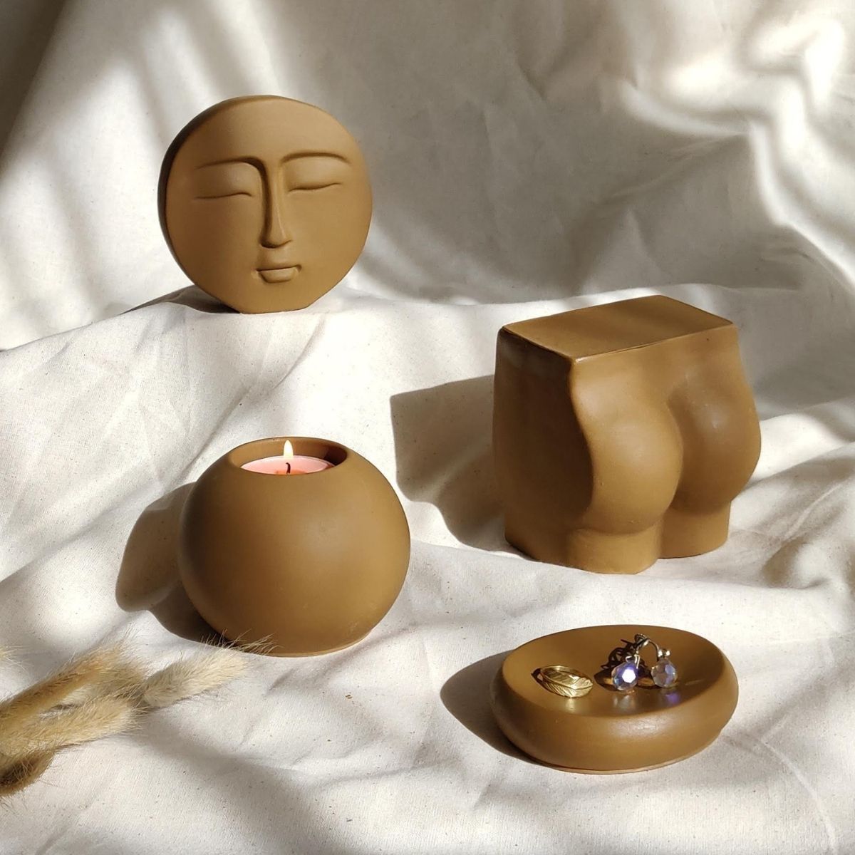 minimalist home decor made of concrete style material featuring trinket dish, tea light holder, and decorative ornaments